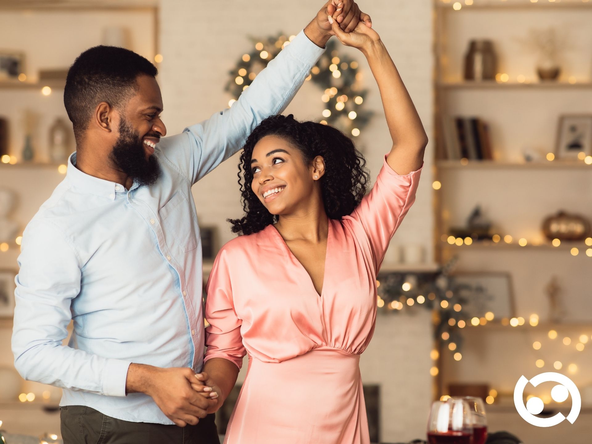 Couple dancing under festive lights