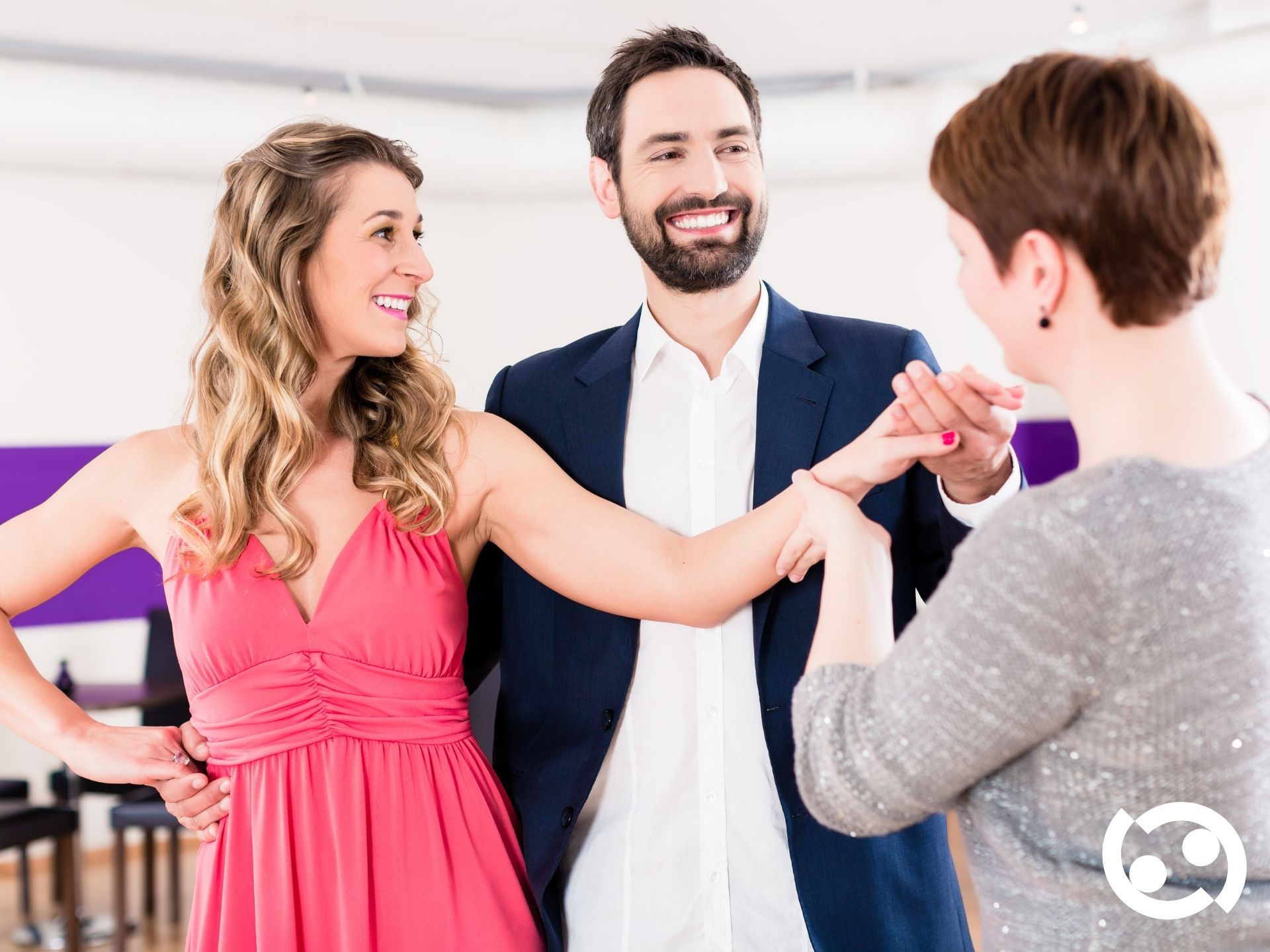 Professional instructor teaching a couple in a private lesson