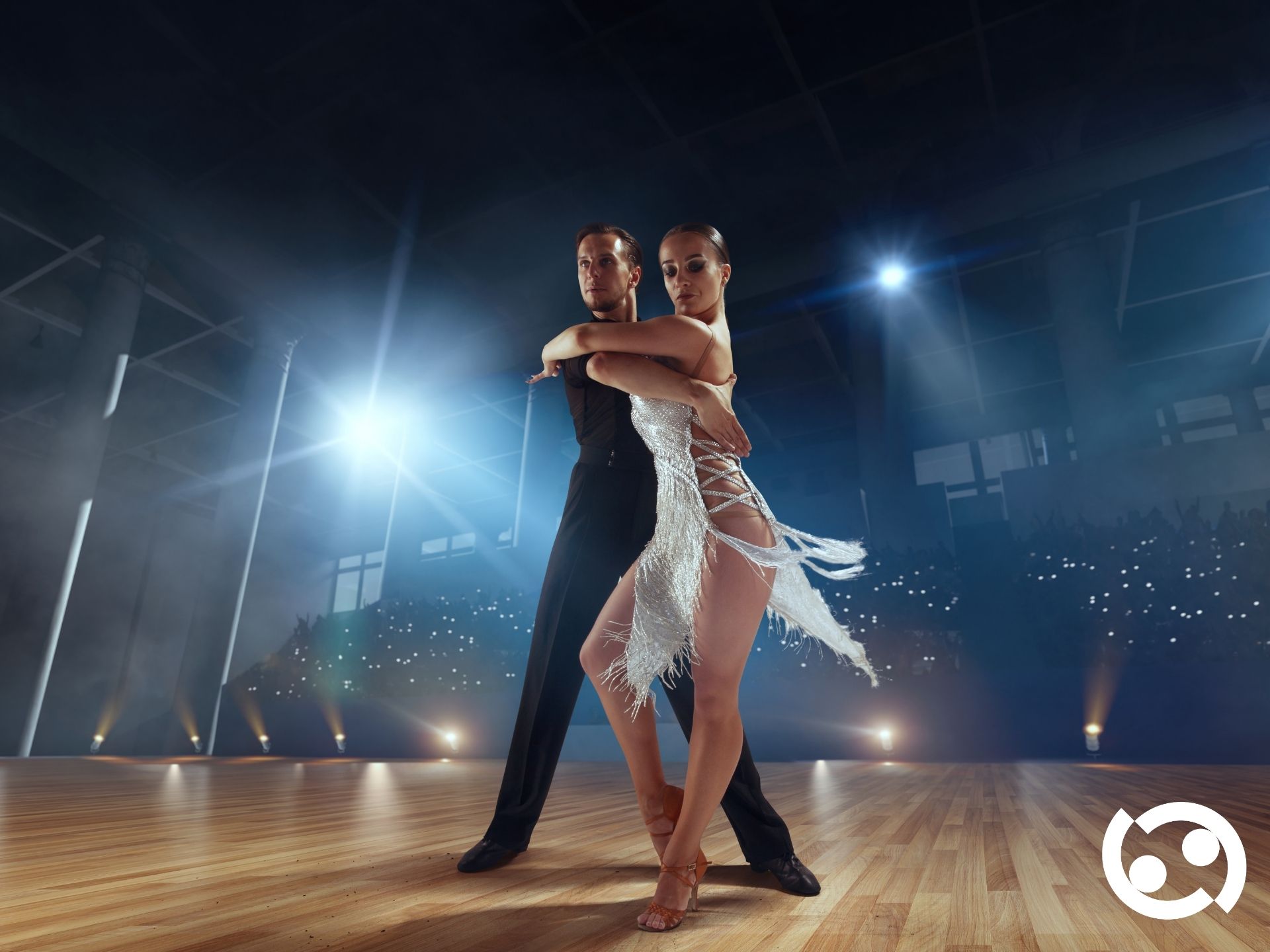 Professional instructor on stage under spotlight
